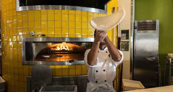 california pizza kitchen chef tossing dough