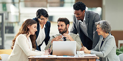 A group of professionals sitting around a table