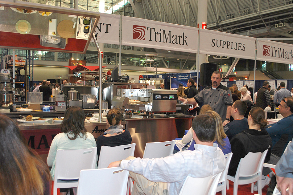 Crowd and presenter at foodservice expo
