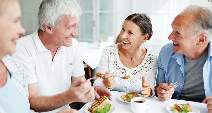 Enjoying lunch in a retirement home dining room