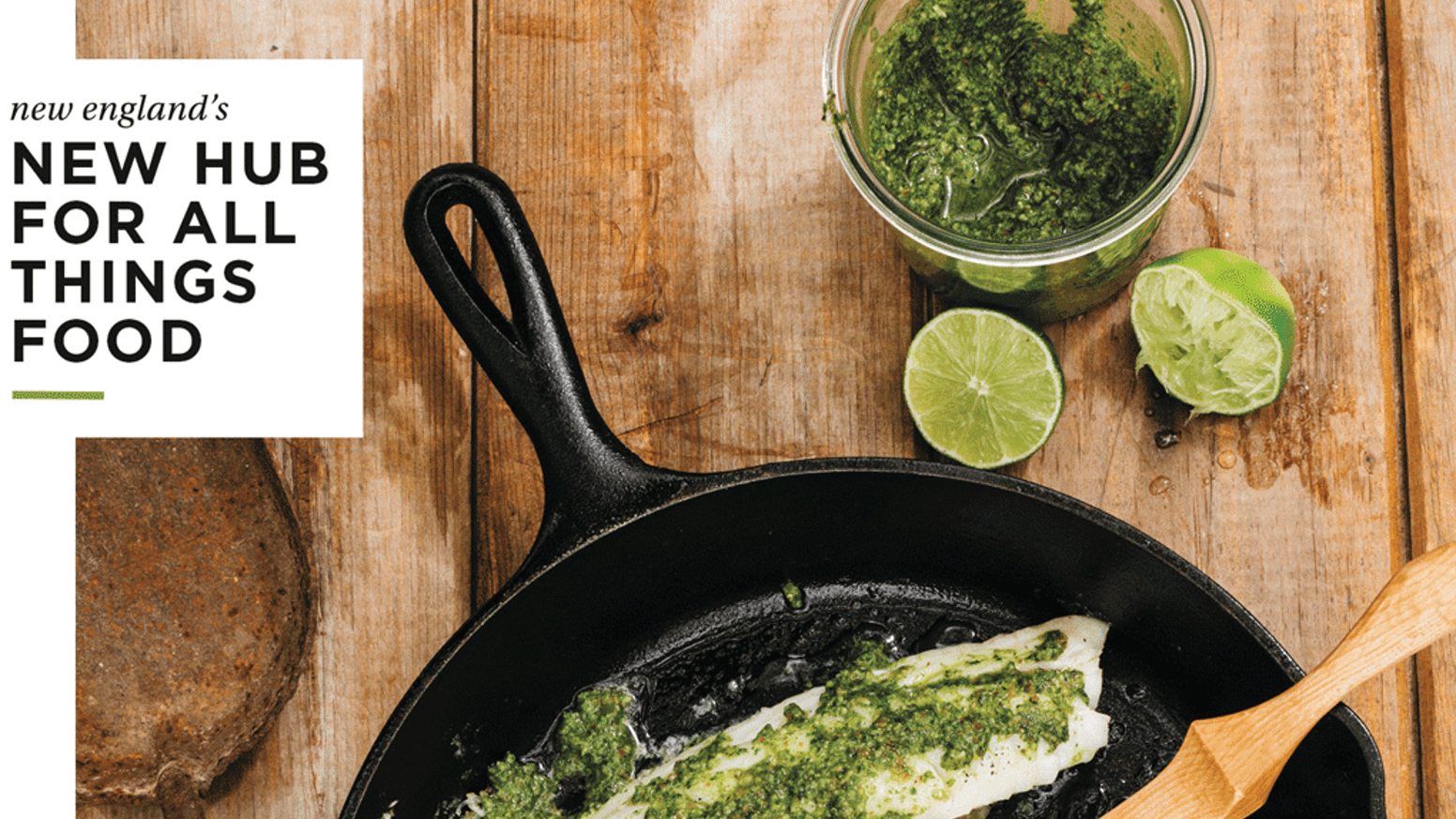 Cast Iron Skillet, limes, pesto and fish on wood background  