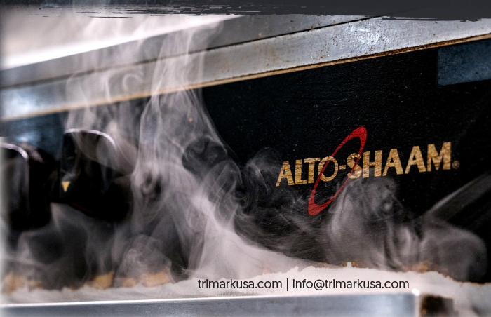 Close up of Alto-Shaam logo on Smoker with steam rising