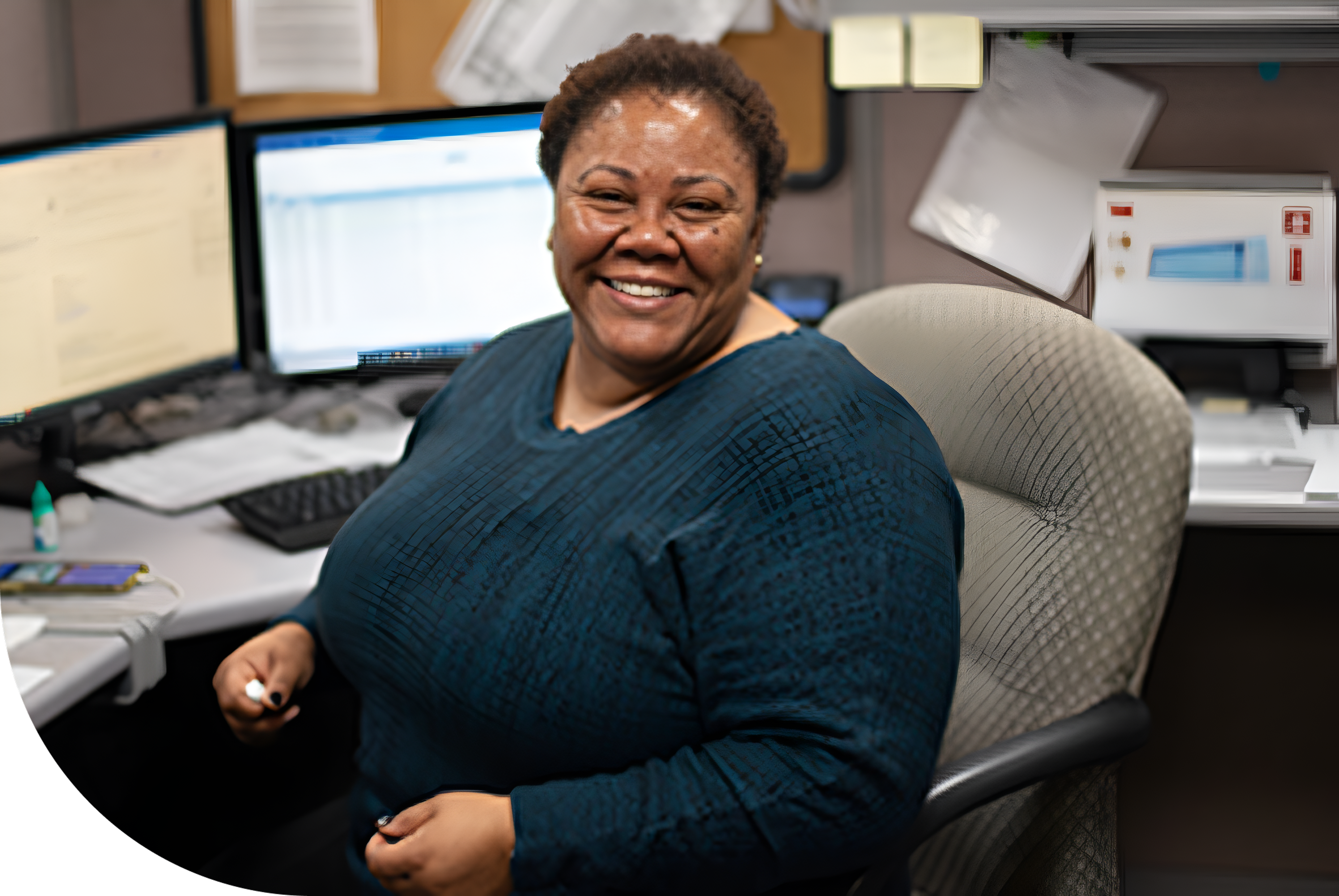 TriMark Employee smiling at her desk