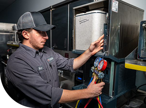 TriMark technician running diagnostics on a machine